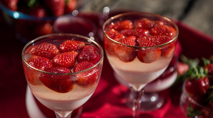 Fresh strawberry jelly on old wooden background. Tasty healthy vegetarian dessert sugar free. 
