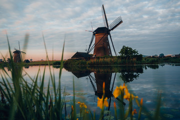 Amazing sunrise of beautiful windmills at Kinderdijk, The Netherlands during sunrise, no tourists due to Covid-19