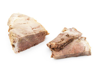 Piece and slices of cooked delicious juicy meat isolated on a white background