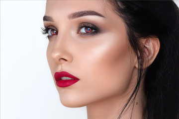 Fototapeta premium a beauty brunette mystery woman portrait, red vampire eyes