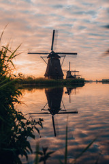 Amazing sunrise of beautiful windmills at Kinderdijk, The Netherlands during sunrise, no tourists due to Covid-19