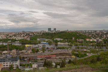
views of Prague on the roofs of buildings and traffic during the spring day