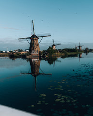 Fototapeta na wymiar Amazing sunrise of beautiful windmills at Kinderdijk, The Netherlands during sunrise, no tourists due to Covid-19