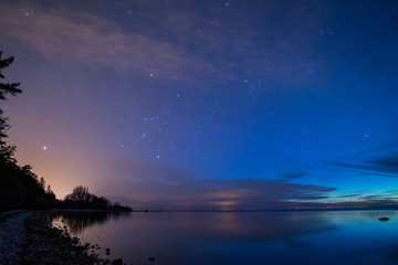 Naklejka na ściany i meble calm ocean under starry sky, Sweden