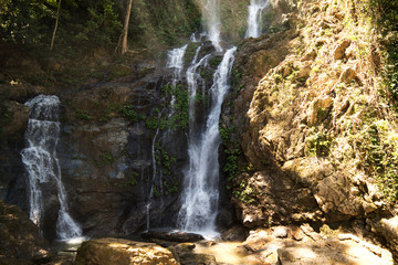 Obraz premium High waterfall in the rainforest on the island of Mindoro in Philippines