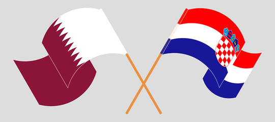 Crossed and waving flags of Croatia and Qatar