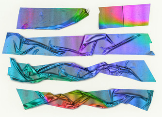 Crumpled pieces of sticky neon foil tape isolated on white background, rainbow sticker set with teared edges, color blocking design elements.
