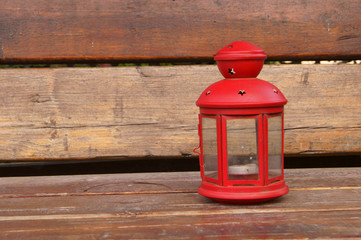 Red Latern On The wooden garden Bench