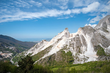 Fototapeta na wymiar panoramic landscape of white marble quarries of Carrara inthe Apuan Alps. Colonnata, Massa Carrara district. Tuscany,Italy