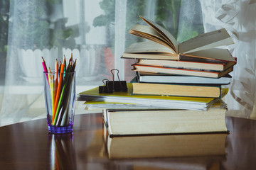 School things close-up: colored pencils, books, notebooks