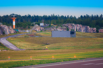 A view from airport apron with the radar tower and firehouse in the background.