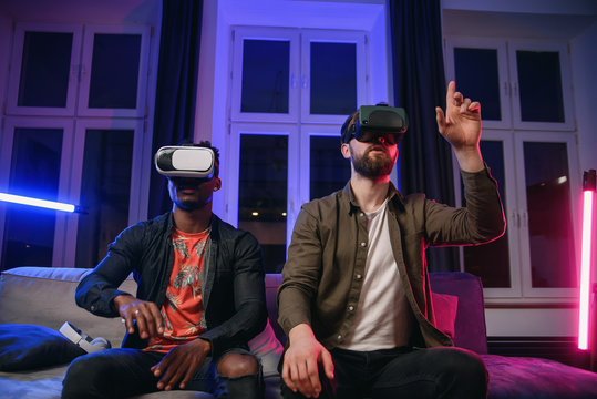 Two freelancers, developers having fun and working on new app for virtual reality goggles