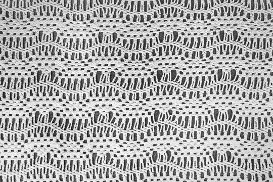 old-fashioned crochet lace zigzag pattern on dark gray background