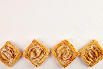 Delicious Puff with apples and cinnamon on a white background, strudel