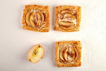 Delicious Puff with apples and cinnamon on a white background, strudel