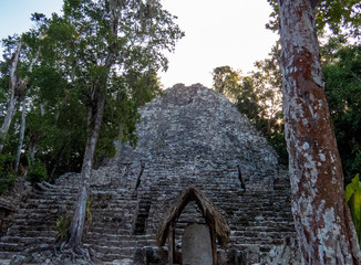 Peaceful moment close to a Mayan pyramid from the middle of the tropical forest in Coba, Mexico.