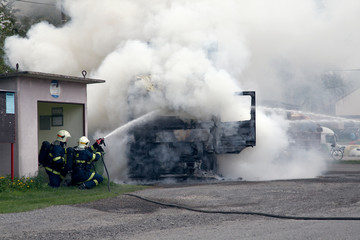 Fototapeta na wymiar Fire truck. Thick gray smoke.