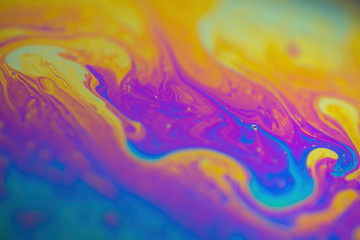 iridescent rainbow on the surface of a soap bubble sphere. Colorful background insane colors...