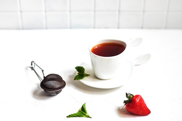 Mini-pancakes, Tiny pancakes, trendy food.
Fritters with fruit: blackcurrant, strawberry, mint. Breakfast with tea