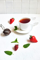 Mini-pancakes, Tiny pancakes, trendy food.
Fritters with fruit: blackcurrant, strawberry, mint. Breakfast with tea