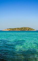Fototapeta premium empty tropic island scenic view without people in popular and famous summer vacation destination site of Greece Mediterranean landscape environment concept picture in vertical format