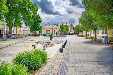 Pedestrian zone with small square in centre of spa town Piestany (SLOVAKIA) - obrazy, fototapety, plakaty