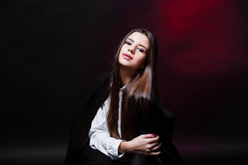 Beauty. Femininity. Beautiful female face with perfect genuine skin. Beauty salon. Make-up artist. Portrait of a beautiful woman in the studio. Girl in a white shirt and jacket. Face. Pretty Girl.