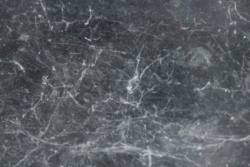 Obraz na płótnie Canvas Old gray scary spider web on black window against dark background