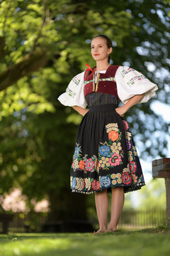 Young beautiful slovak woman in traditional costume. Slovak folklore.