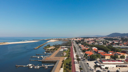 Aerial view of palm trees promenade and cycle path, Esposende, The marginal riverside, along the mouth of the Cavado River in Esposende, Portugal.