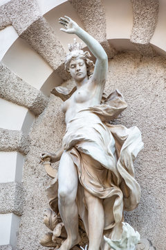Hofburg statue Power by Sea Fountain by Rudolf Weyr in Vienna, Austria. Close-up. Vertical orientation. 