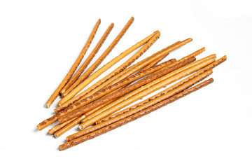 Pile of pretzel sticks isolated on white background. Salty snacks