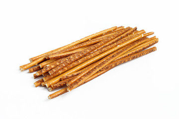 Pile of pretzel sticks isolated on white background. Salty snacks