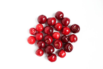 Group of delicious organic cherries isolated on white background. Tasty red fruit