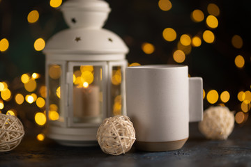 White cup with coffee or tea, hot chocolate, for layout and design logo placement, with a nightly atmosphere, Christmas, New Year