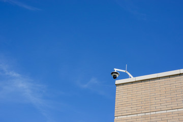 A security camera on a building