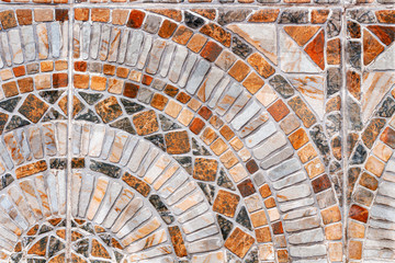 Stone mosaic texture. Abstract outdoor tile. Geometry design with squares and rounds. Natural material background
