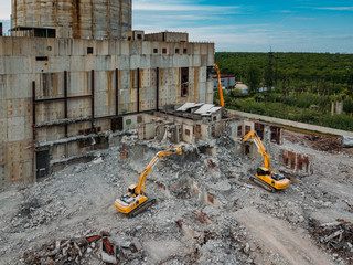 Aerial view of demolition site. Process of demolition of old industrial building