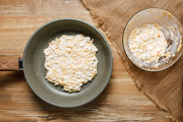 transfer the resulting mass to the pan and fry without oil under the lid.Step by step recipe of lazy khachapuri pie. step six