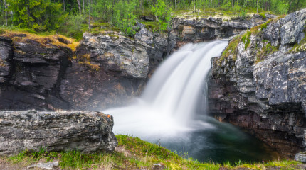 Beautiful waterfall scenery from Ula river in Rondane national park in Norway.