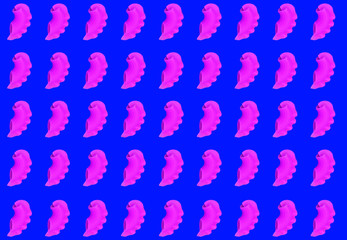 Raw pink pasta arranged in parallel on a blue background