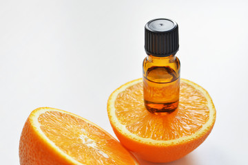 Bottle of orange fruit essential oil. Aromatherapy treatment. Naturopathic medicine. Copy space.