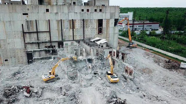 Aerial view of demolition site. Process of demolition of old industrial building