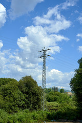 utility poles with sky in the background