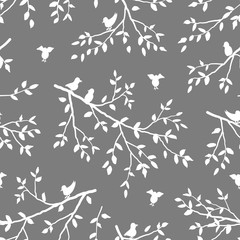 Seamless pattern with birds and branches of tree. Tree branches with leaves on a gray background. Spring or summer background. Vector illustration