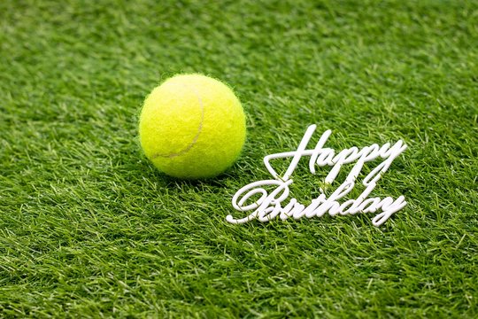 Tennis Birthday with tennis ball on green grass