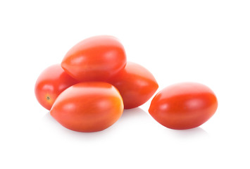 Falling plum tomatoes isolated on white background
