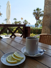 breakfast in the cafe, a cup of tea and lemon wedges