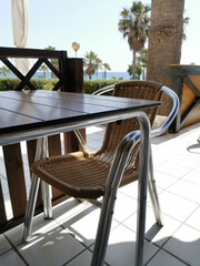Table near the sea at sunny vacation day
