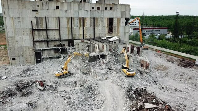 Aerial view of demolition site. Process of demolition of old industrial building
